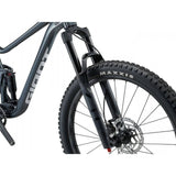 Giant Stance mountain bike with 125mm rear suspension, 140mm fork, black frame, and knobby tires for trail riding.