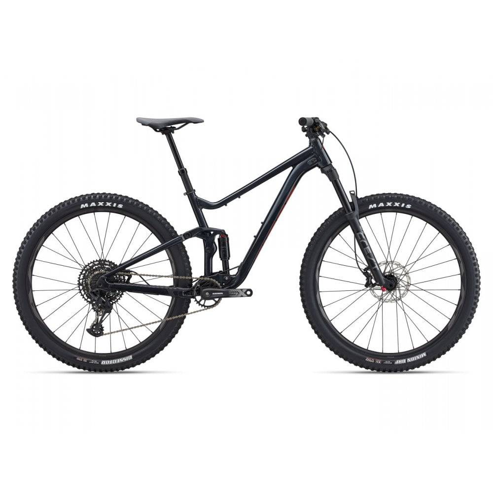 Giant Stance 29 mountain bike with full suspension and FlexPoint system, black and red frame, ready for trail riding.