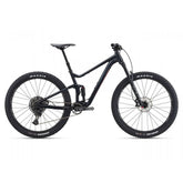 Giant Stance 29 mountain bike with full suspension and FlexPoint system, black and red frame, ready for trail riding.