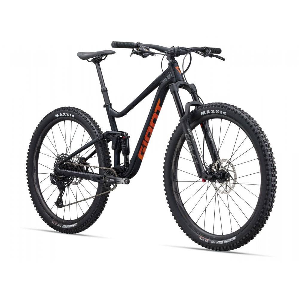 Giant Stance 29 1 full suspension mountain bike with FlexPoint suspension system, featuring rugged tires and sleek frame design.