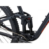 Giant Stance 29 1 full suspension mountain bike with FlexPoint suspension system, shown with rugged trail background.