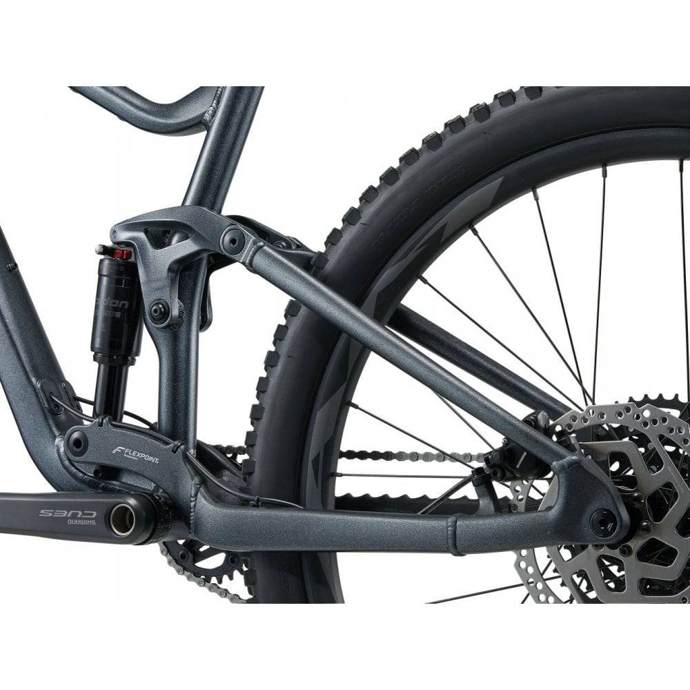 Giant Stance 29 2 full suspension mountain bike with Shimano CUES U6000 components, featuring a sturdy frame and knobby tires.