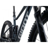 Giant Stance 29 2 full suspension mountain bike with Shimano CUES U6000 components, showing the bike's frame and suspension system.