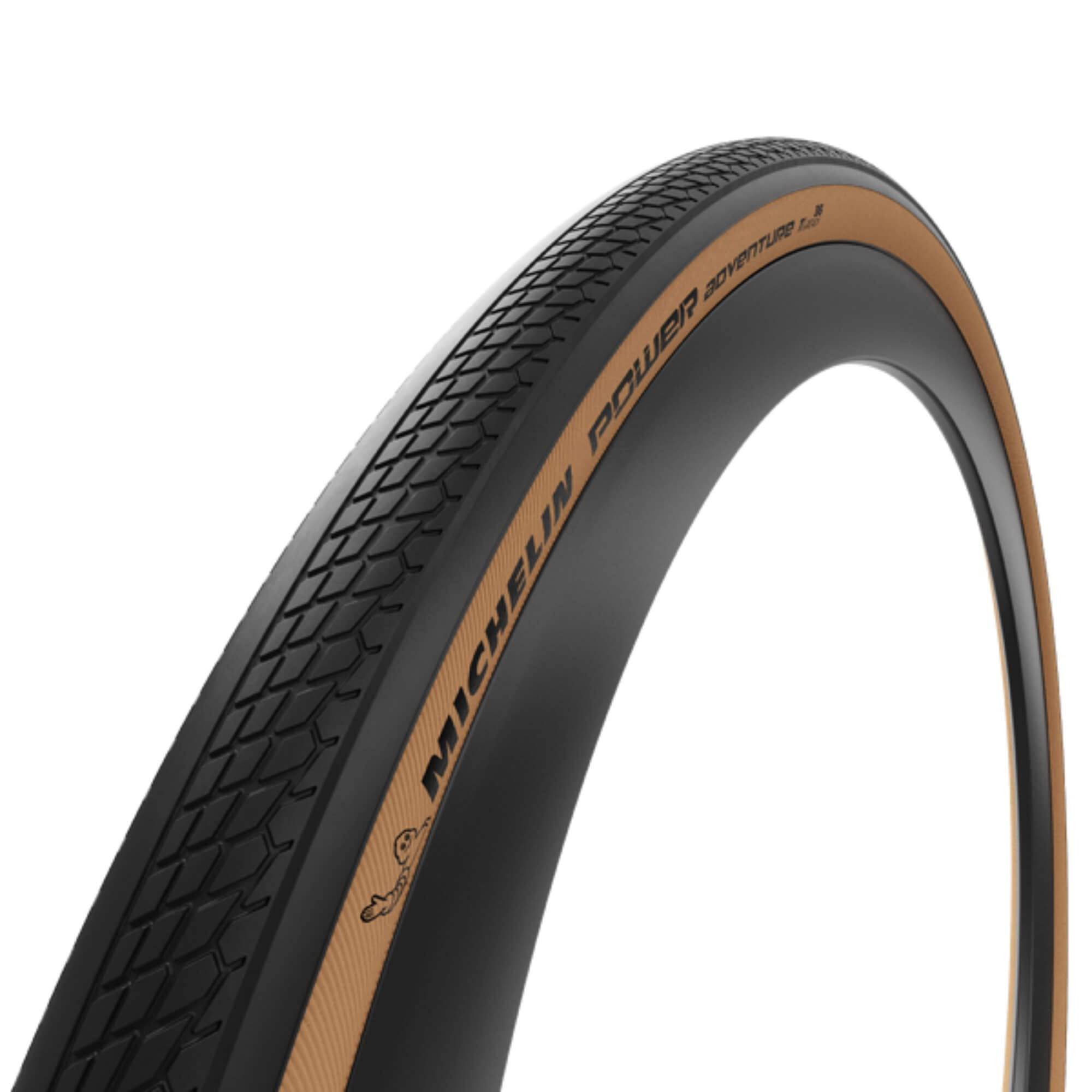 Michelin Power Adventure gravel tyre with tubeless ready design and puncture protection, suitable for off-road cycling.