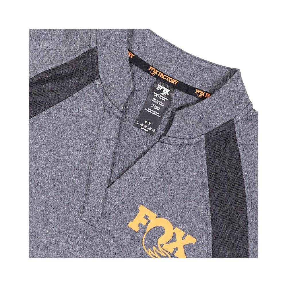 Unisex Fox Shop Shirt Jersey, stretch performance top with cycling and work-ready design, in a close-up shot of the fabric and branding.