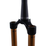Fox Fork 32 SC Kashima CSU assembly for mountain bike, showing detailed components and finish in natural setting.