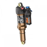 Fox Float X Factory rear shock for trail bikes, 2-position adjustable mountain bike suspension component with brand logo visible.