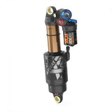 Fox Float X2 Factory mountain bike rear shock with 2-position adjustable damping, showing its black and silver body with mounting hardware.