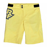 Race Face Sendy Youth mountain bike shorts with adjustable waist and zippered pockets, designed for active outdoor riding.