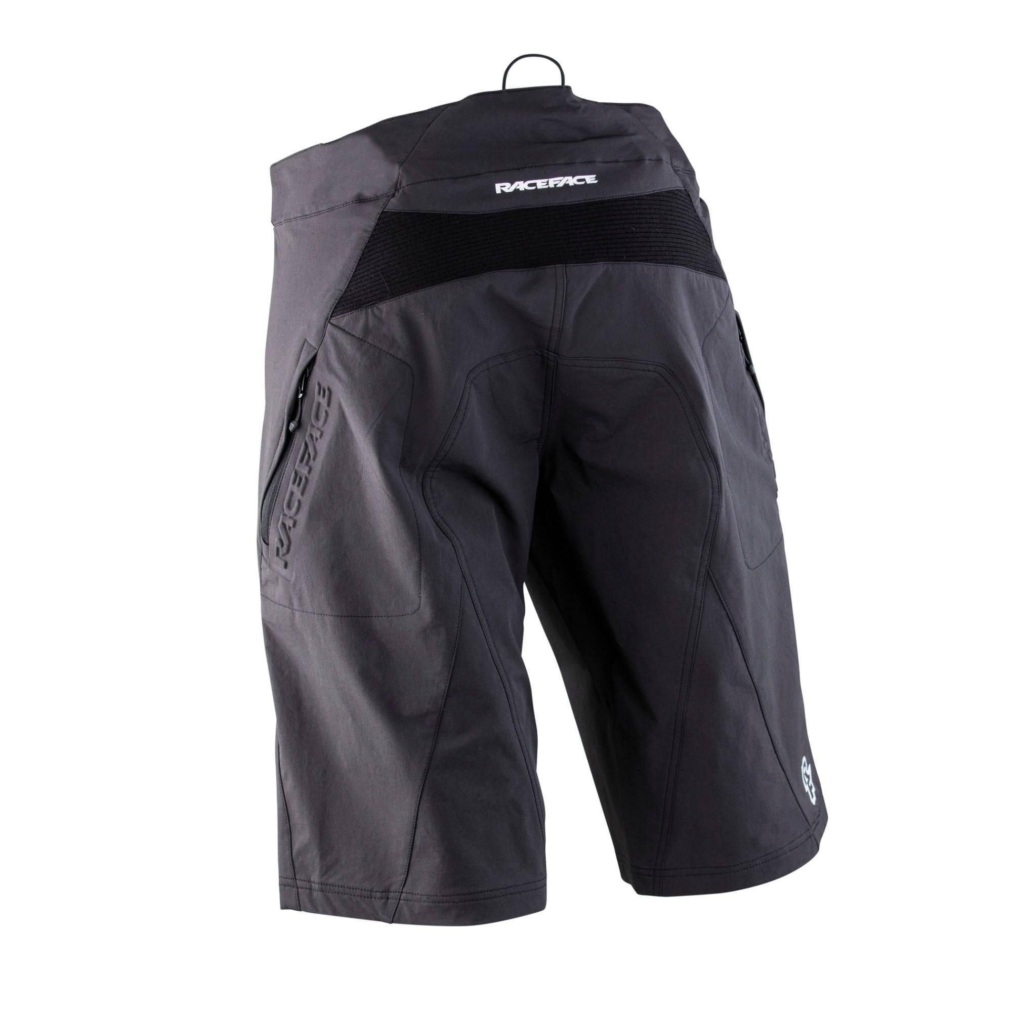 Race Face Ruxton unisex MTB shorts with adjustable ratchet closure and multiple pockets, designed for mountain biking comfort.