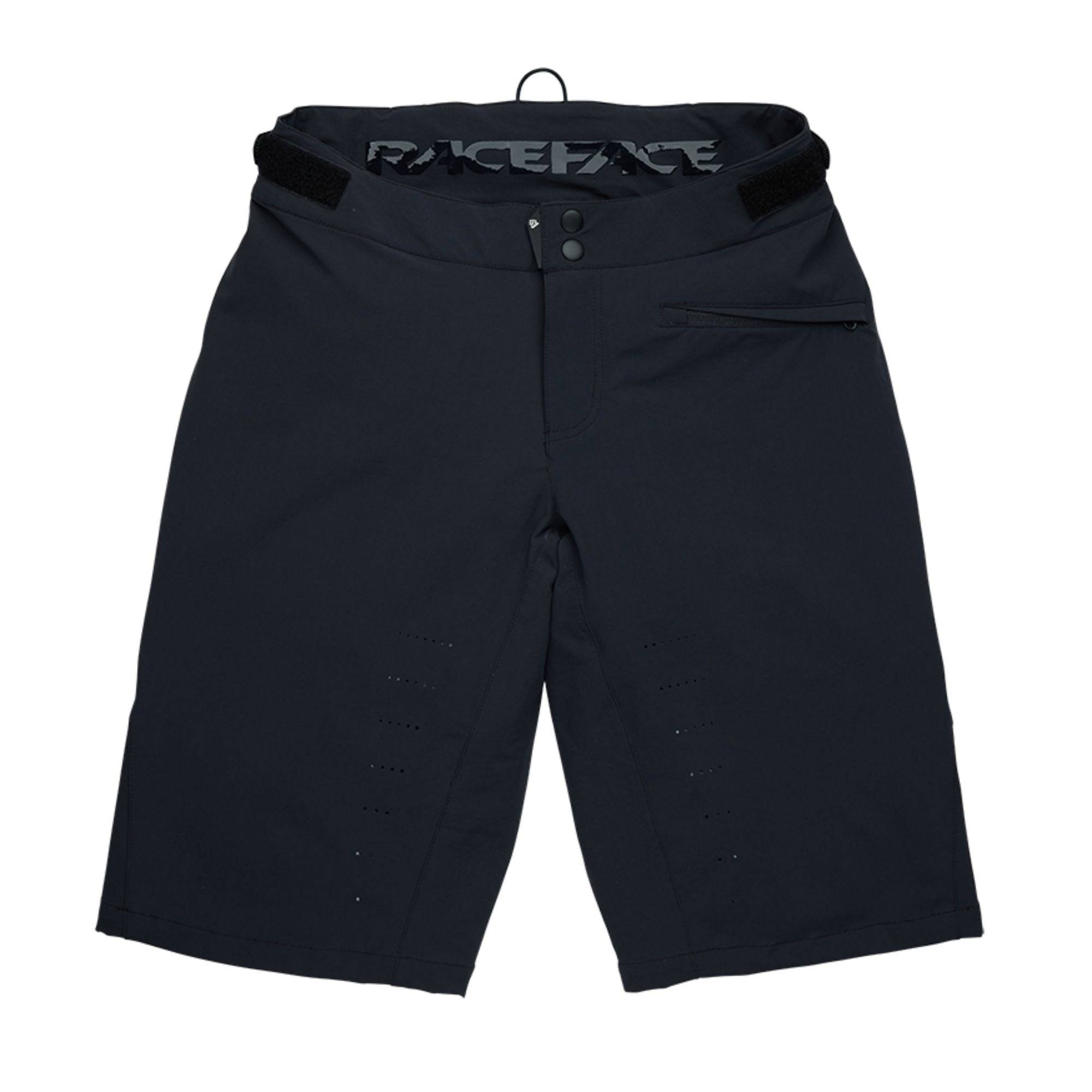 Race Face Indy women's mountain bike shorts with adjustable waist and zippered pockets, designed for comfort and mobility.