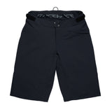 Race Face Indy women's mountain bike shorts with adjustable waist and zippered pockets, designed for comfort and mobility.