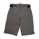 Race Face Indy women's mountain bike shorts with adjustable waist and zippered pockets, designed for outdoor cycling comfort.
