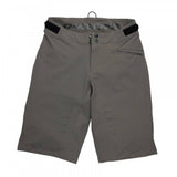 Race Face Indy women's mountain bike shorts with adjustable waist and zippered pockets, designed for outdoor cycling comfort.