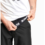 Race Face Traverse unisex mountain bike shorts with adjustable fit and multiple pockets, designed for cycling comfort and durability.