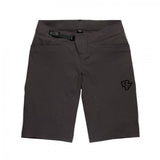 Race Face Traverse unisex mountain bike shorts with adjustable fit and multiple pockets, designed for outdoor cycling comfort and durability.