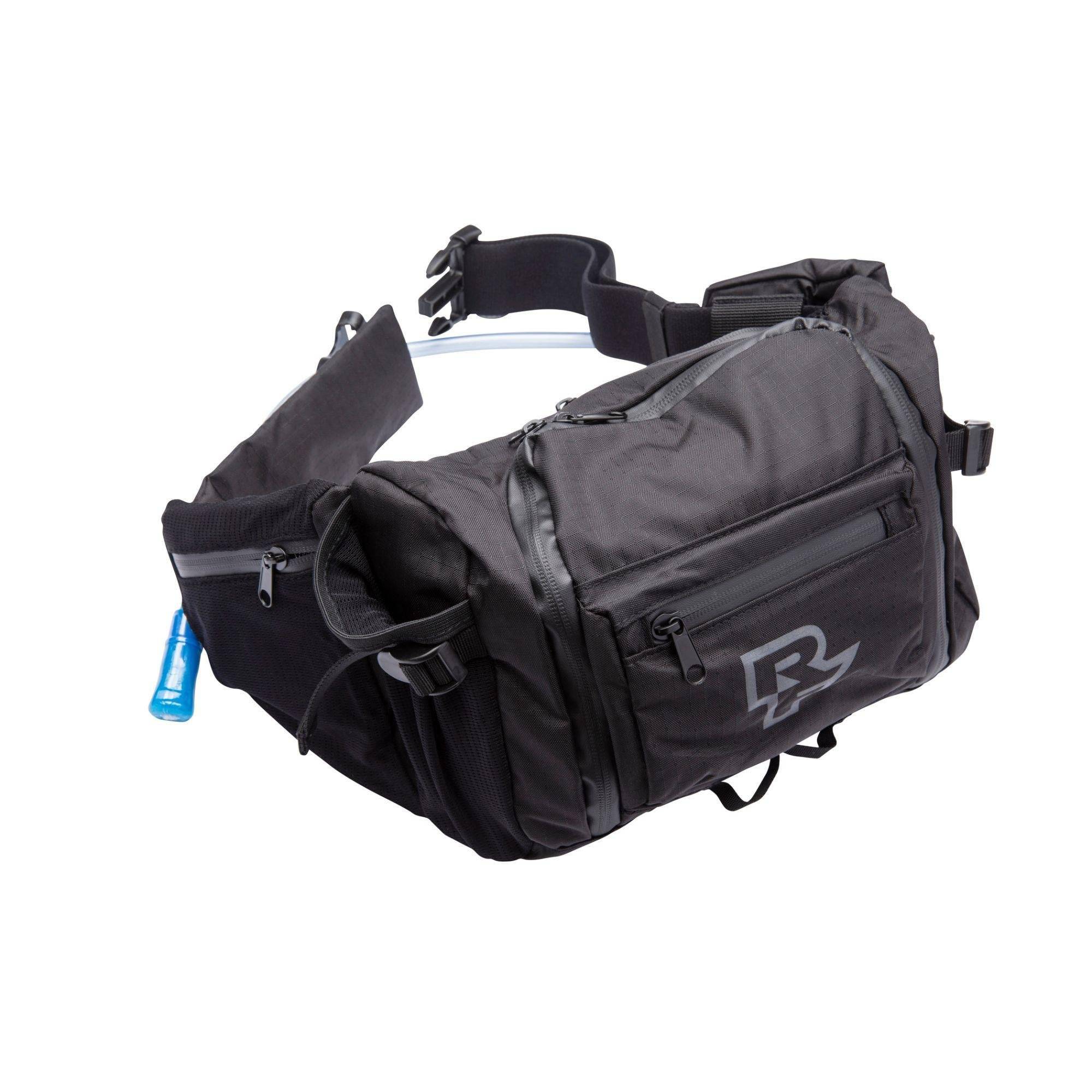 Race Face Stash 3L hydration hip bag with water-resistant pockets, tool bench, and compact design for outdoor activities.