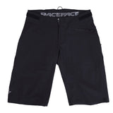 Race Face Indy Women's All-Mountain Shorts 2021 with venting and adjustable waistband, shown on a model in a mountain biking setting.