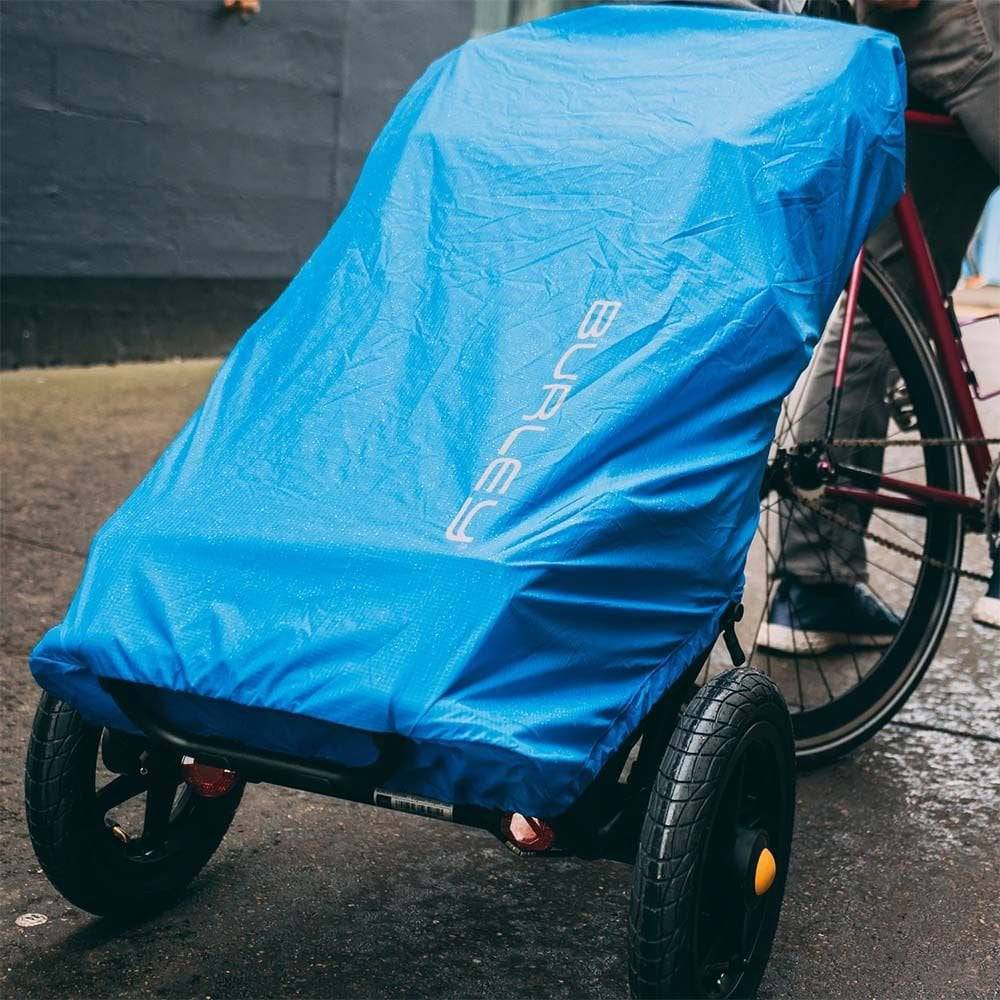 Burley Travoy rain cover with reflective high-visibility accents for cargo protection against rain and weather.