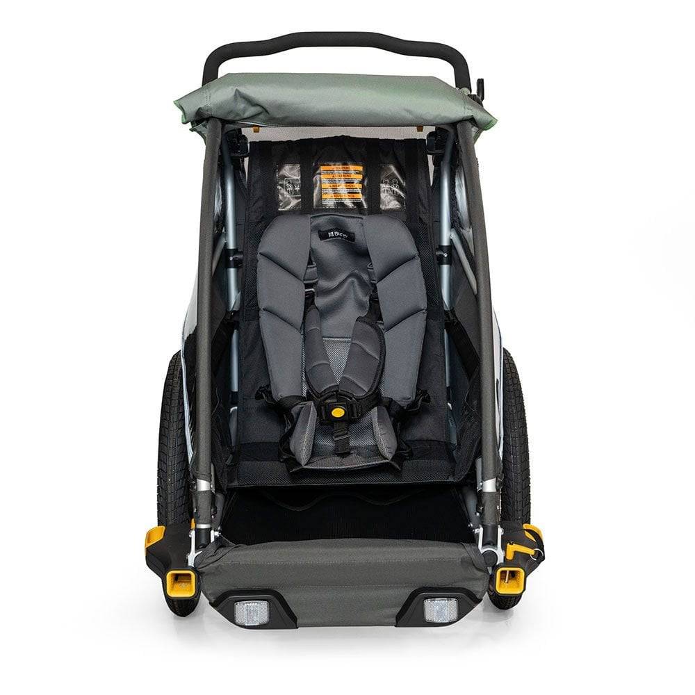 Burley Baby Snuggler Seat accessory with 5-point safety harness for bike trailers, providing secure comfort for infants.