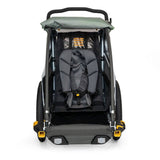 Burley Baby Snuggler Seat accessory with 5-point safety harness for bike trailers, providing secure comfort for infants.