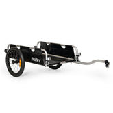 Burley flatbed cargo bike trailer with foldable two-wheel design, ideal for bulk hauling and accessories.