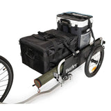 Burley flatbed cargo bike trailer with foldable two-wheel design for hauling bulk items, shown with cargo area and sturdy frame.