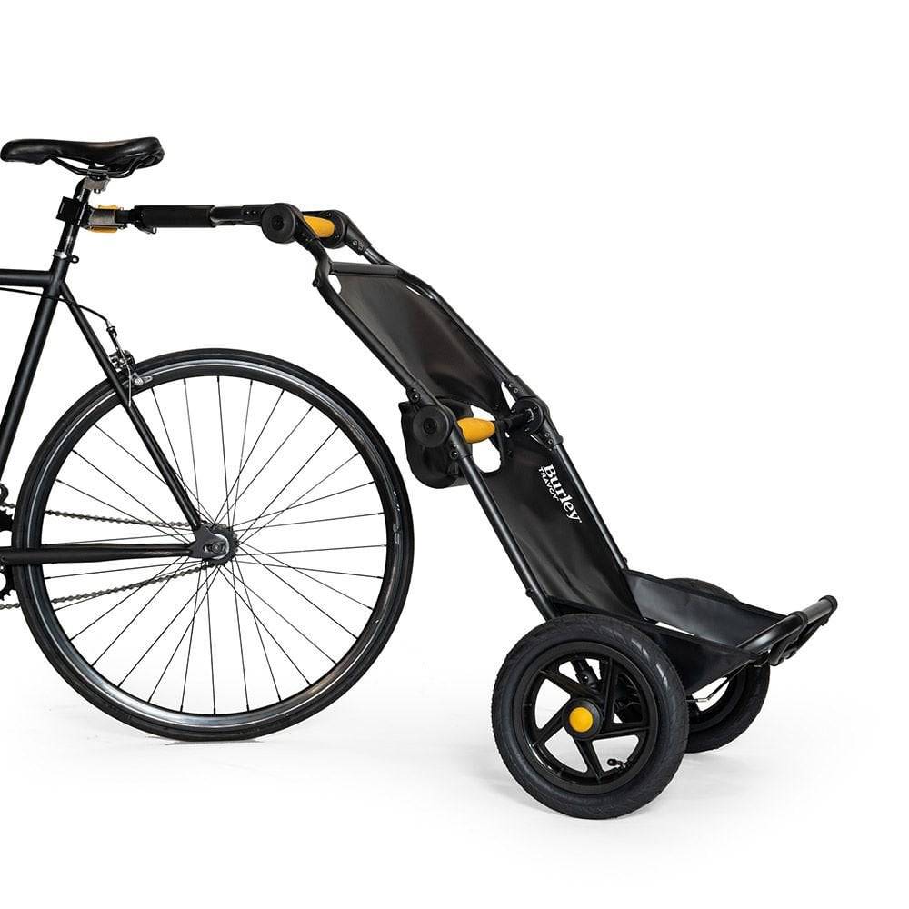 Burley Travoy cargo bike trailer in a folded position, showcasing portable and compact design for easy transport and storage.