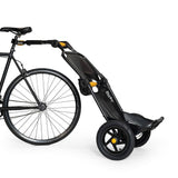 Burley Travoy cargo bike trailer in a folded position, showcasing portable and compact design for easy transport and storage.