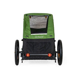 Burley Tail Wagon pet trailer with foldable design, safety flag, and bike-only compatibility, suitable for transporting pets securely.