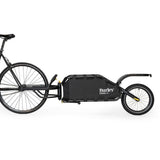 Burley Coho XC cargo bike trailer with suspension and quick release lever, designed for versatile cycling and cargo transport.