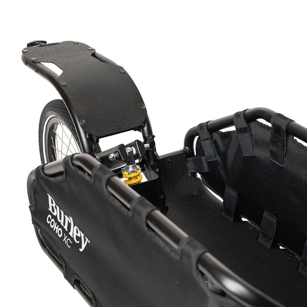 Burley Coho XC cargo bike trailer with suspension and quick release lever, designed for versatile cycling accessories.
