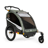 Burley D'Lite X double bike trailer and stroller with adjustable suspension, featuring a sturdy frame and comfortable seating.