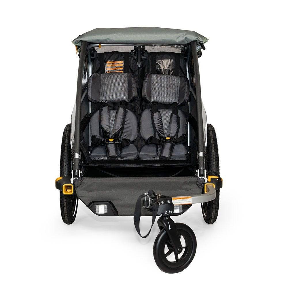 Burley D'Lite X double bike trailer and stroller with adjustable suspension, featuring durable fabric and safety harnesses.