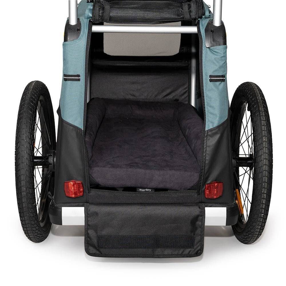 Burley pet bed accessory with removable foam inserts, designed for Tail Wagon and Bark Ranger trailers, providing comfortable dog rest.