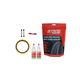 Stan's No Tubes Road Tubeless Kit with sealant, valves, and yellow tape for bicycle wheel setup and maintenance.