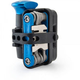 Park Tool RTP-1 Rescue Tool Pod with MTB-5 multi-tool and TPT-1 tubeless plug tool for bike repair in workshop setting