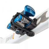 Park Tool RTP-1 Rescue Tool Pod with MTB-5 multi-tool and TPT-1 tubeless plug tool, displayed in a workshop setting.