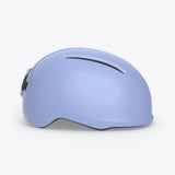 MET Vibe Mips helmet with integrated USB LED light for urban e-bike safety, shown with sleek design and adjustable straps.