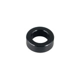 Trek Rocker Link Spacer 5.7mm x 10mm in black for full-suspension bike components, showing a close-up of the spacer part.