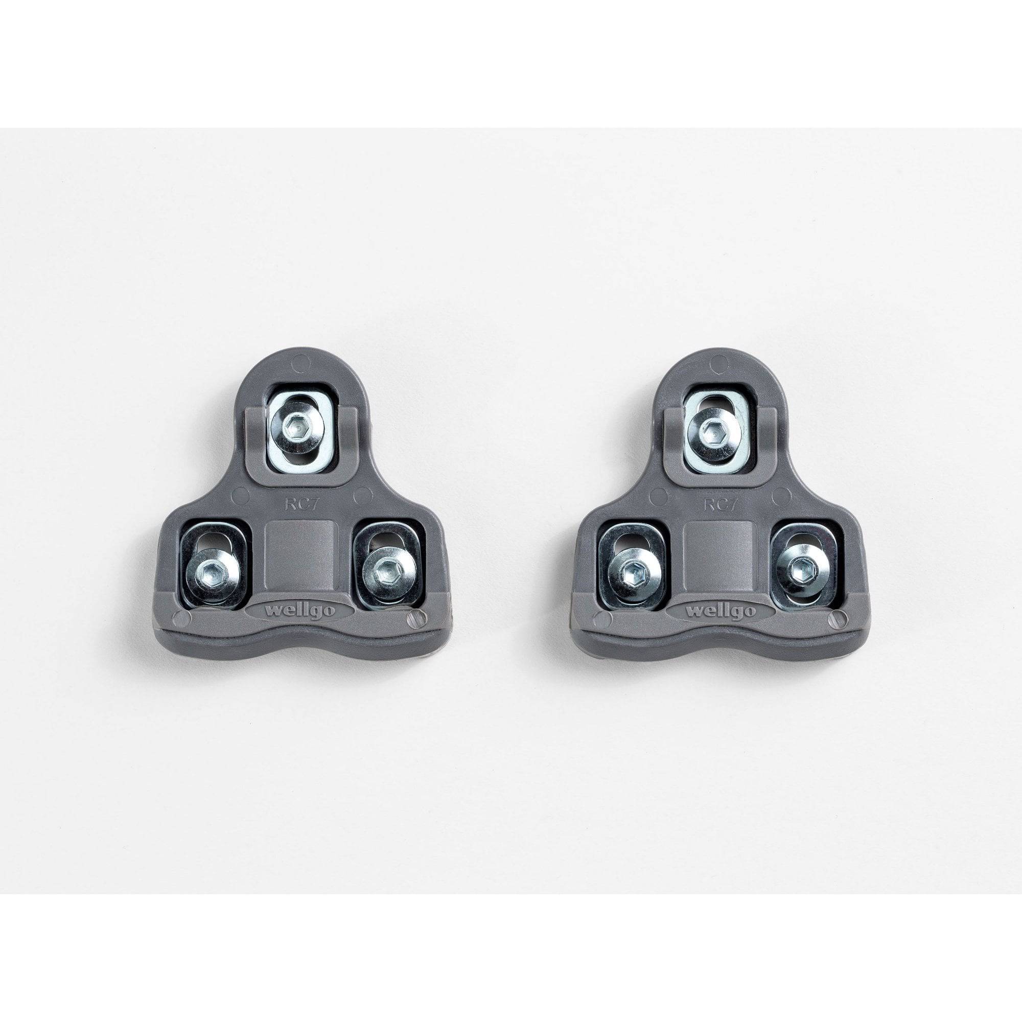 Bontrager grey road clipless pedal cleat set with mounting hardware, designed for cycling shoes and compatible with clipless pedals.