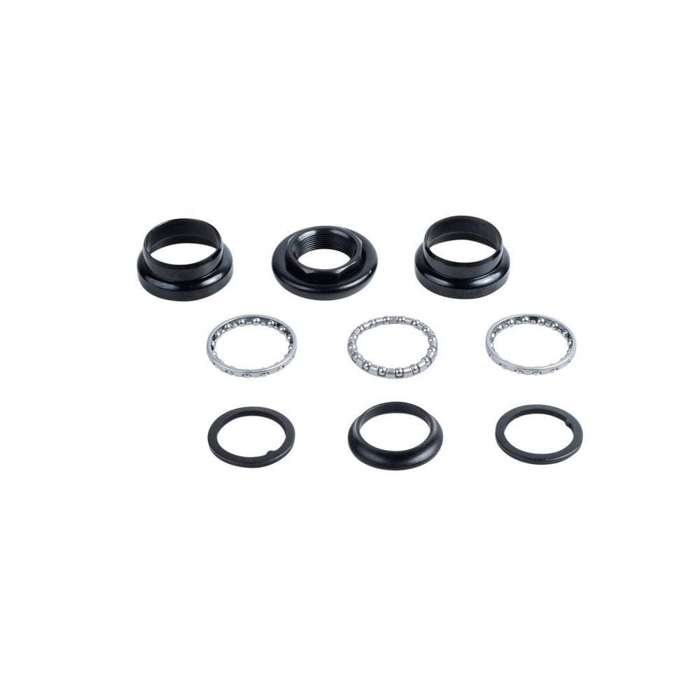 Black Trek Kids' headset reducer adapter converting 1-1/8" to 1" threaded steerer for bicycle components.