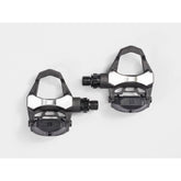 Bontrager Elite Road Pedal Set in black with cleats and adjustable tension, compatible with 9/16-inch crank arms for cycling.