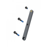 Black Trek Checkpoint third bottle cage adapter with bolts, designed for bike components, installed on a bicycle in a natural riding scene.