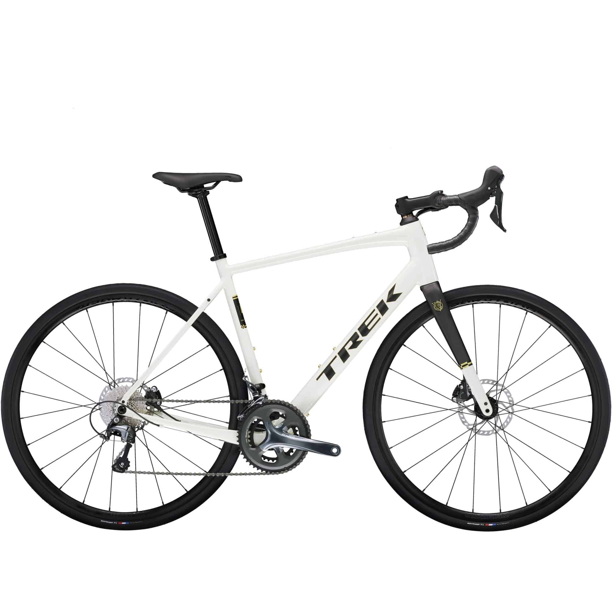 Trek Domane AL 4 Gen 4 road bike with Shimano Tiagra 10-speed drivetrain and disc brakes, positioned on a scenic road.