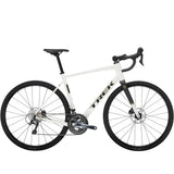 Trek Domane AL 4 Gen 4 road bike with Shimano Tiagra 10-speed drivetrain and disc brakes, positioned on a scenic road.