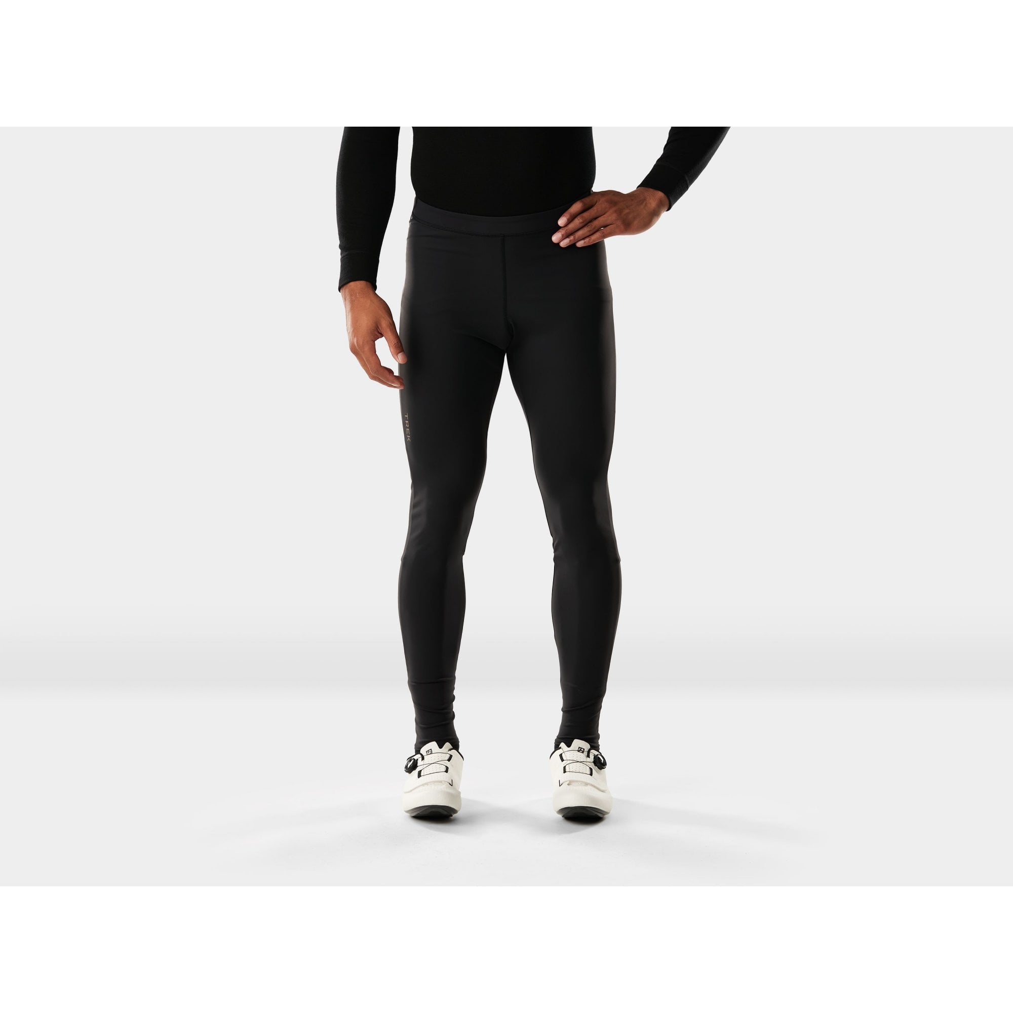 Trek Circuit thermal unpadded cycling tights in black, close-up view showing fitted design and stretch fabric for cold-weather riding.