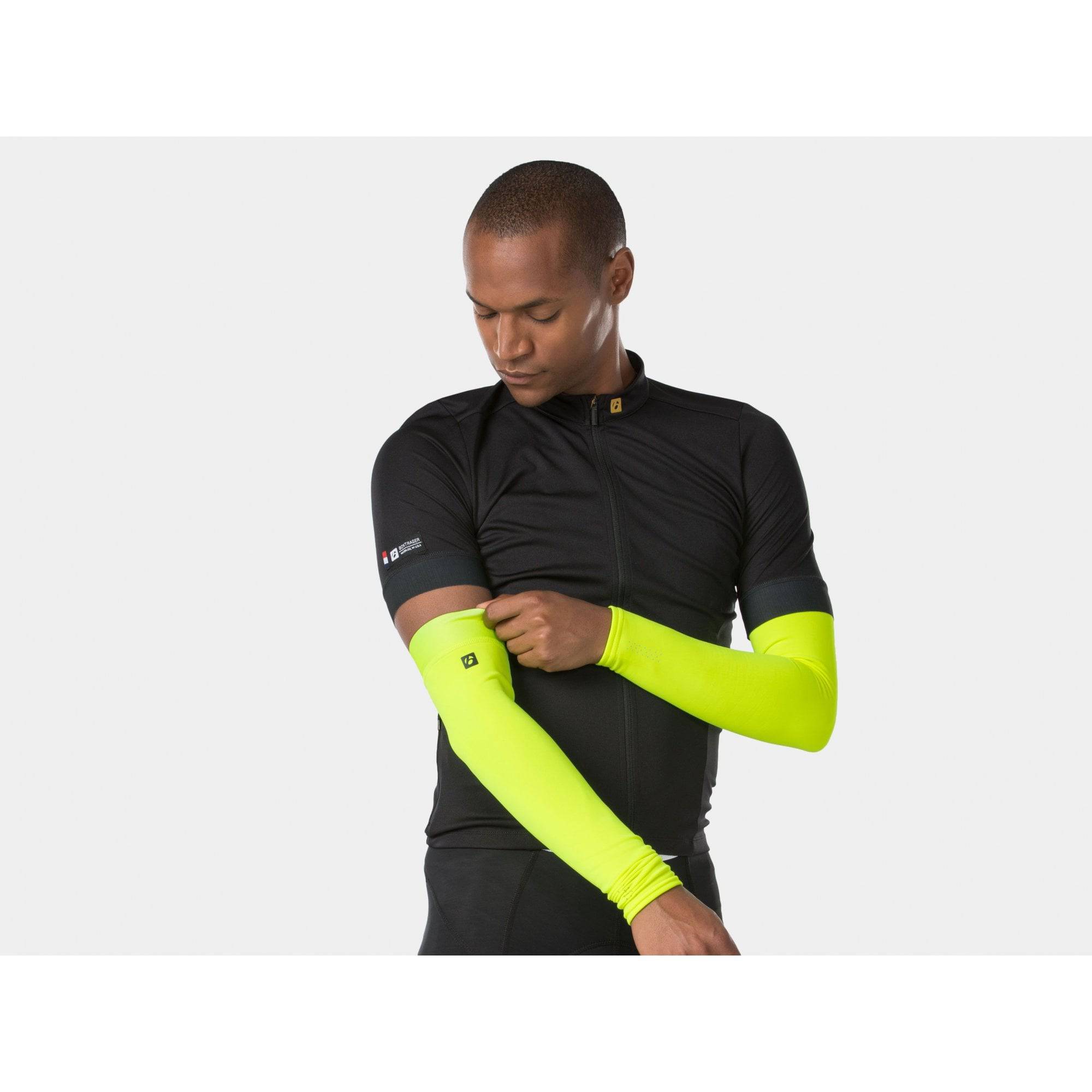 Bontrager thermal cycling arm warmers showing a fitted, breathable, moisture-wicking fabric design for outdoor riding.