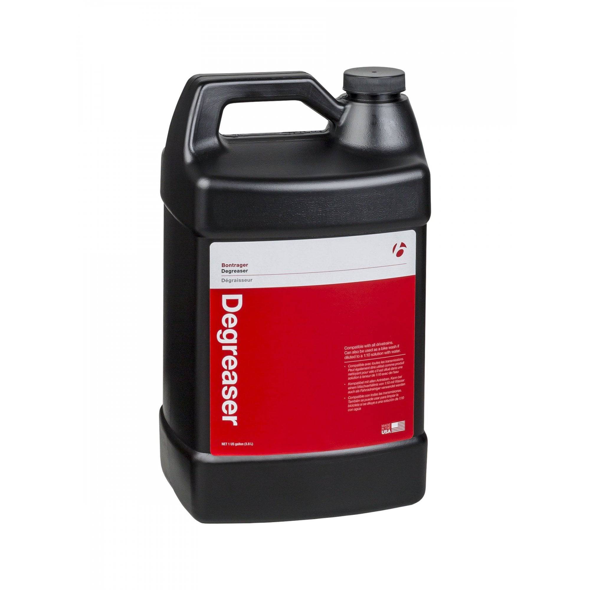 Bontrager bike degreaser and lubrication cleaner with citrus scent for drivetrain maintenance, shown in workshop setting.