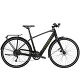 Trek FX+ 2 e-hybrid bike with HyDrive pedal assist, front lights, mudguards, and rear rack, ready for city commuting.